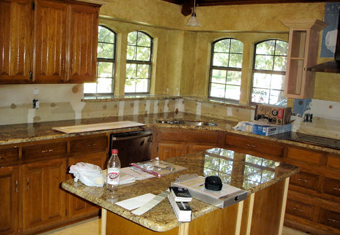 Dark-colored cabinets before painting