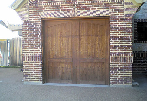 Unfinished wooden garage door