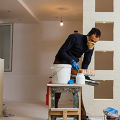 Man preparing to remove popcorn paint