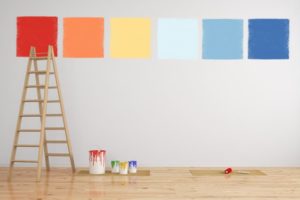 six different paint color samples painted on a wall