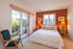 bedroom with orange accent wall