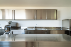 a painted kitchen with stainless steel appliances 