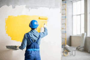 a homeowner painting an accent wall