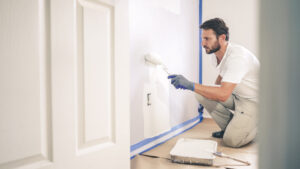 a person painting their home’s interior